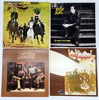 Front covers of the four vinyl LP records showing The Doobie Brothers' The Captain and Me, Billy Joel's An Innocent Man, The Doobie Brothers' Toulouse Street, and Led Zeppelin II.