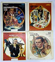 Four LaserDisc covers showing front artwork for four James Bond movies: Dr. No, Goldfinger, From Russia with Love, Live and Let Die, arranged in a square layout.