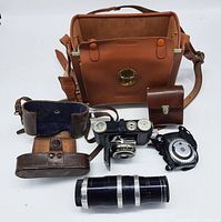 Complete bundle with Kodak Retina camera, Pangénieux f3.5 Type Y2 lens, brown leather carrying case, small leather pouch, vintage light meter, and long lens tube.