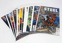 Eleven STEEL comics spread on a flat surface, showing their cover art and condition; comics appear clean and well preserved.