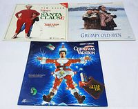 Front covers of 3 Christmas-themed LaserDiscs: The Santa Clause, Grumpy Old Men, Christmas Vacation