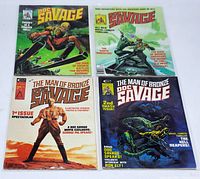 Four vintage Marvel Doc Savage magazines with distinct colorful covers, each bagged and boarded.