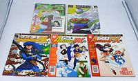Front view of five anime/manga magazines on white background showing colorful covers with various characters from anime series