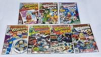 7 vintage Howard the Duck comic books from Marvel Comics Group in clear protective bags on a flat surface, all facing front showing colorful covers with issue numbers.