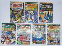 Photo showing seven vintage Marvel Double Feature comics in protective sleeves with backing boards on a white surface.