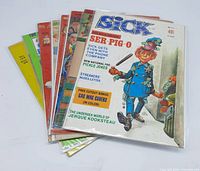 Eight vintage magazines stacked together, front covers visible for two SICK issues showing caricatured characters and headline text, all bagged and boarded