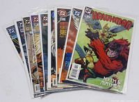 Nine Hawkman comic books individually bagged and boarded, featuring various dynamic and colorful cover art from DC Comics series, showing characters in action and fantasy themes.