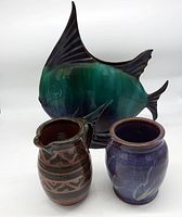 Blue Mountain Pottery fish sculpture with handmade pottery pitcher and blue vase in front, showing full lot.