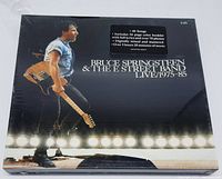 Front cover showing Bruce Springsteen on stage with guitar, title, and details about the 5 LP set.