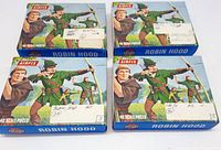 Four closed boxes of Airfix Robin Hood plastic toy soldier sets with illustrated covers showing Robin Hood holding a bow and arrow, each labeled by hand or sticker with scale variants HO, AO, and OO.