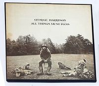 Front of the tri-fold box showing George Harrison photo and album title