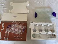 Original packaging with six shot glasses and foam insert inside box, with tray included.