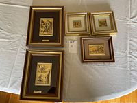 Overview of all five frames arranged on a white cloth for dimension and condition inspection.