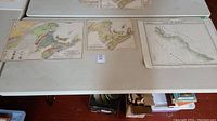 Three foldable antique maps displayed flat on a white surface, showing regions including Nova Scotia, New Brunswick, and Bay of Haven.