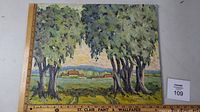 Full view of the original oil painting depicting a landscape scene with trees and country buildings. Shows the size reference via ruler at left side.