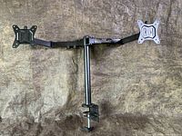 Full view of the dual monitor mount showing adjustable arms and two monitor mounting plates.