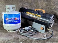Photo showing Remington 95-125 construction gas heater and AmeriGas propane tank side by side.