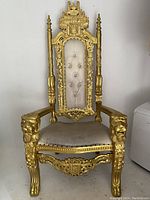 Full frontal view of ornate throne chair showing overall condition