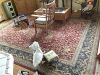 Full view of the Tommy Bahama area rug in a living room setting with furniture on top.