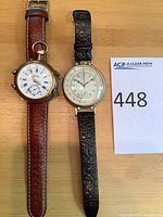 Overall view of both converted pocket watch wristwatches with lot card