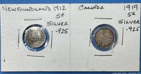 Two 5 cent silver coins mounted on white cards labeled with year, country, and silver content .925. One bent Newfoundland 1912 coin and one Canada 1919 coin shown.