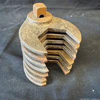 View of 7 Wilco crowfoot wrenches stacked together in a compact block shape seen from the top side.