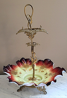 Full view of art glass basket showing scalloped edges and ornate ormolu frame with central handle.