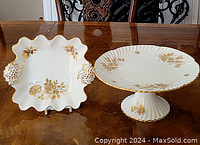 Both Hammersley porcelain pieces displayed on table showing gold floral designs and shapes.