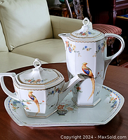 Full view of teapot, coffee pot and tray showing overall design