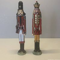 Front view of the two nutcracker figurines, showing detailed paint and design.