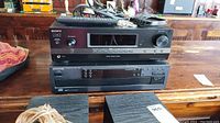 Sony STR-DH130 receiver on top of Kenwood 103CD multiple CD player with Sony remote on top.
