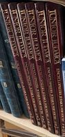 Photo of 6 volumes of Junior Judaica Encyclopaedia Judaica For Youth on bookshelf showing spine titles