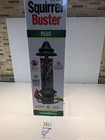 Front of boxed Squirrel Buster Plus feeder showing capacity and branding