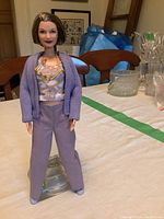 Full front pose of Mattel Age Friendly Barbie Doll showing outfit, hairstyle, and glasses.