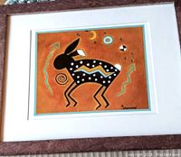 Framed and matted stylized jackrabbit print with signature visible in bottom right corner.