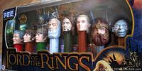 Photo of the full Lord of the Rings Pez Collector's Series set in unopened original box showing all character dispensers in a row inside packaging.