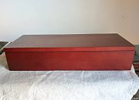 Top closed view of the cherry-wood dresser box showing clean and intact surface