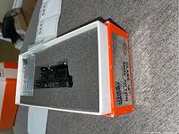 Class A Shay 20 Ton model train locomotive inside foam-lined white box with orange edges, showing packaging and labeling