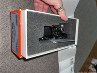 Locomotive in foam-lined box with lid removed showing unused condition