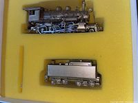 Locomotive and tender nestled in yellow foam inside original box