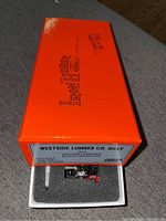 Orange “Iron Horse Models” box partially opened showing model inside