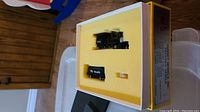Foam tray containing locomotive, tender and bag of parts in Sunset Models box