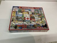 Image of the jigsaw puzzle box showing the assembled puzzle image and branding