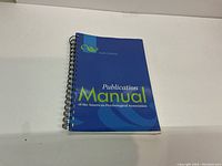 Front cover of the spiral bound 6th edition APA Publication Manual showing title and edition info.