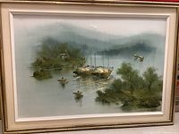 Full view of original signed vintage painting depicting boats on water with wooded shoreline and misty hills.