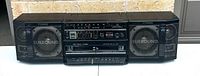 Front view of the entire Fisher boombox showing speakers, radio tuner, and cassette decks.