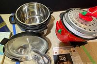 Instant Pot Duo stainless steel pressure cooker with lid, original box, and instruction book