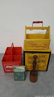 Lot of 5 items including Coca-Cola carriers, sausage seasoning tin, tobacco tin, and wooden utensil