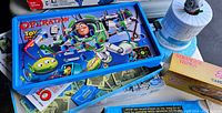 Operation Toy Story 3 game board featuring Buzz Lightyear and green alien characters in bright blue plastic.