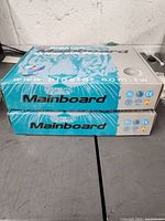 Two closed Biostar mainboard boxes stacked